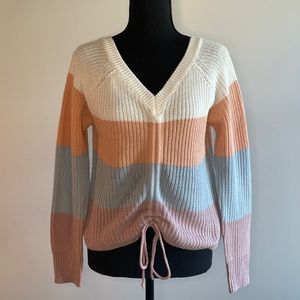 Striped sweater with adjustable tie in the front in a size medium womens.